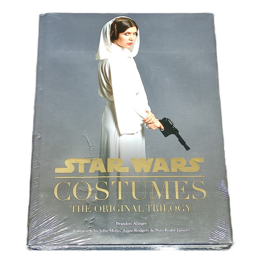 Book titled 'Star Wars Costumes: The Original Trilogy' with a character holding a gun on the cover.