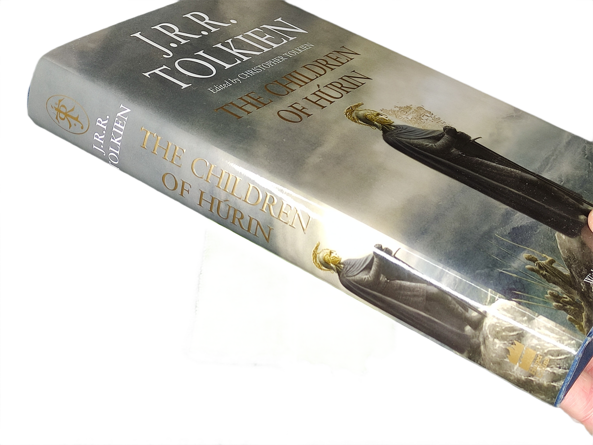 Book titled 'The Children of Hürin' by J.R.R. Tolkien on a white background