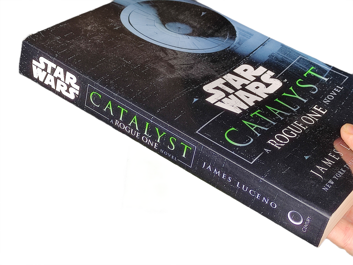 Book titled 'Catalyst' by James Luceno from the Star Wars series held by a hand.