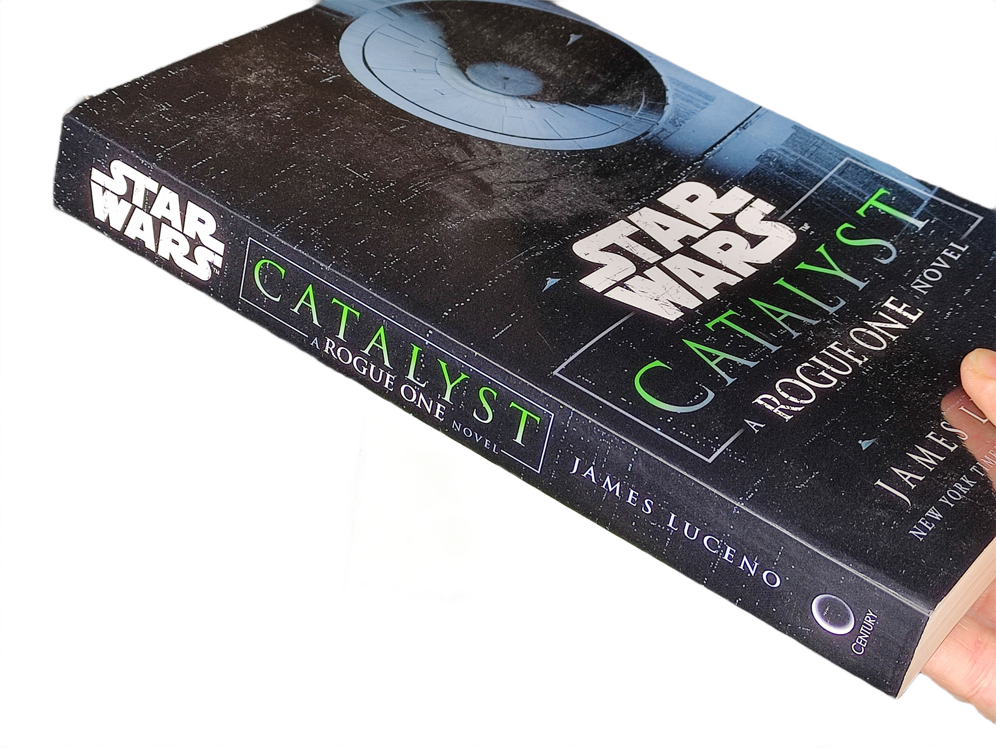 Book titled 'Catalyst' by James Luceno from the Star Wars series held by a hand.