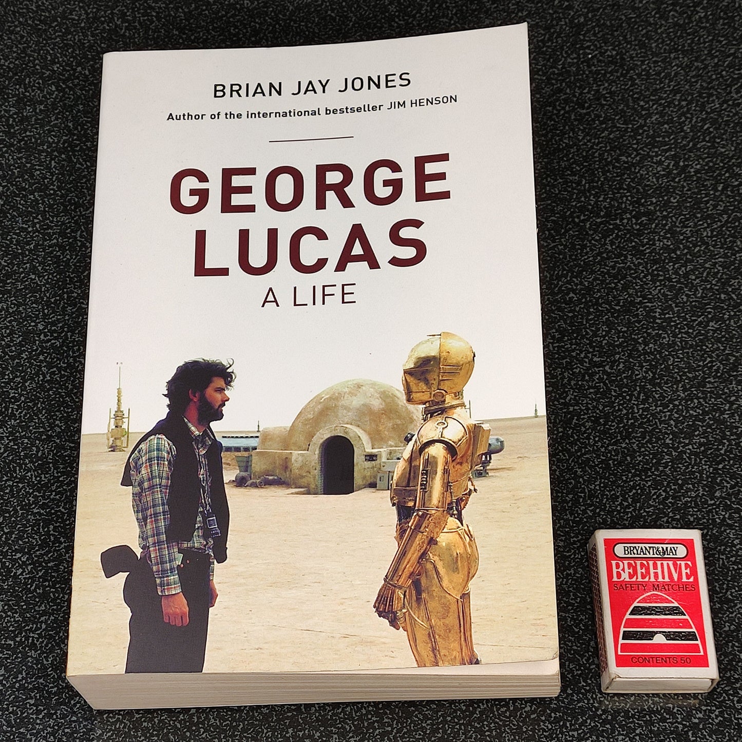 Book titled 'George Lucas: A Life' by Brian Jay Jones on a dark textured surface