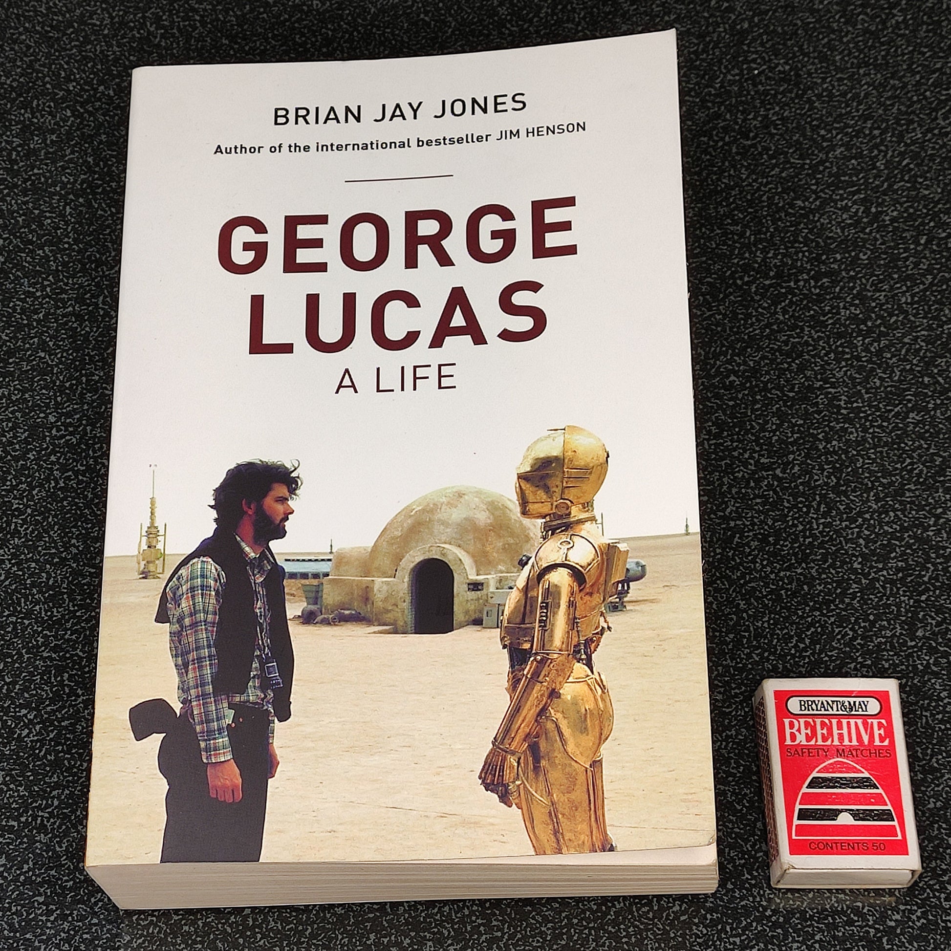 Book titled 'George Lucas: A Life' by Brian Jay Jones on a dark textured surface