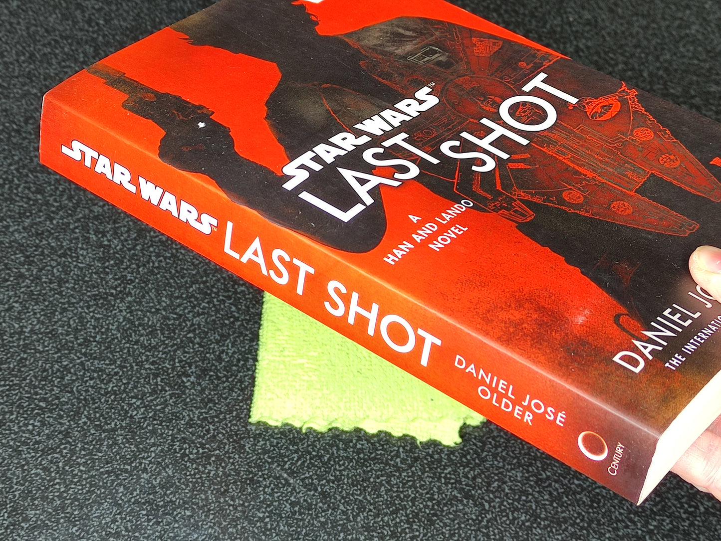 Book titled 'Star Wars: Last Shot' by Daniel José Older on a textured surface.