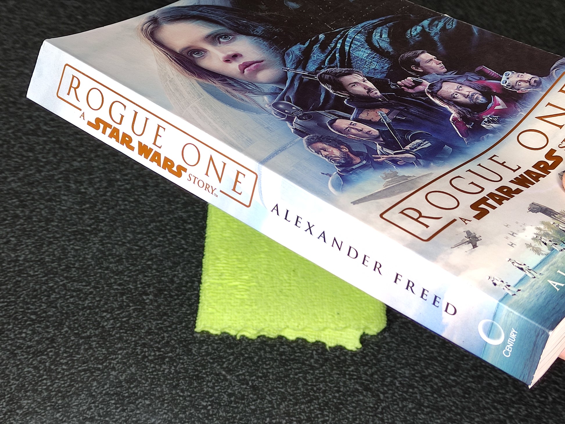 Book titled 'Rogue One: A Star Wars Story' by Alexander Freed on a textured surface.