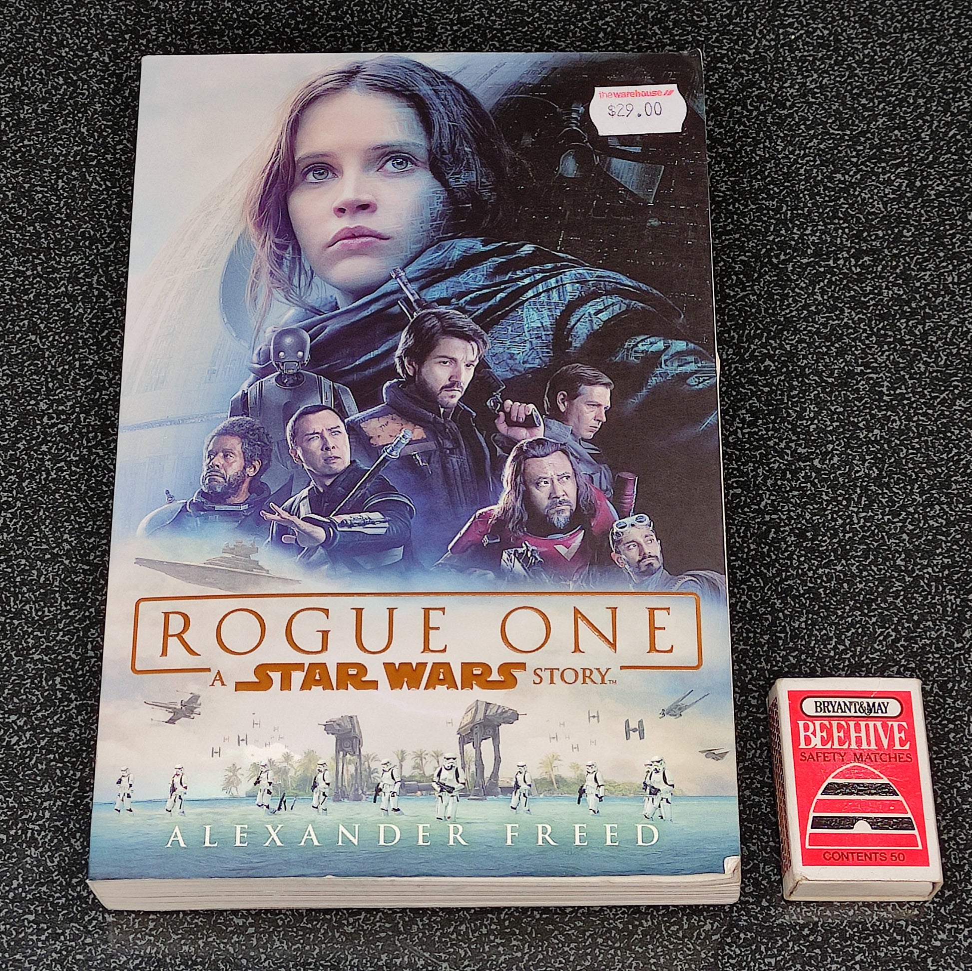 Book titled 'Rogue One: A Star Wars Story' by Alexander Freed on a dark textured surface