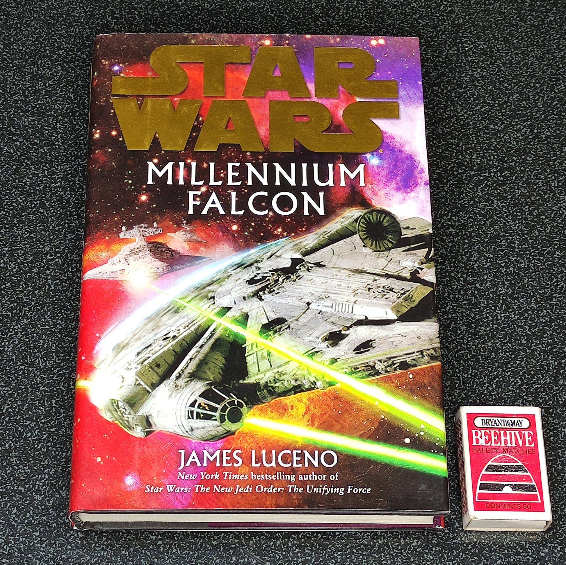 Star Wars Millennium Falcon book by James Luceno on a black textured background