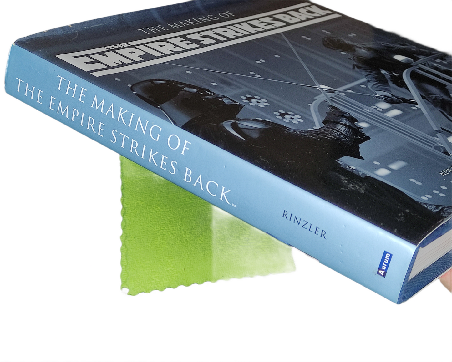 Book titled 'The Making of The Empire Strikes Back' with a star wars character on the cover.