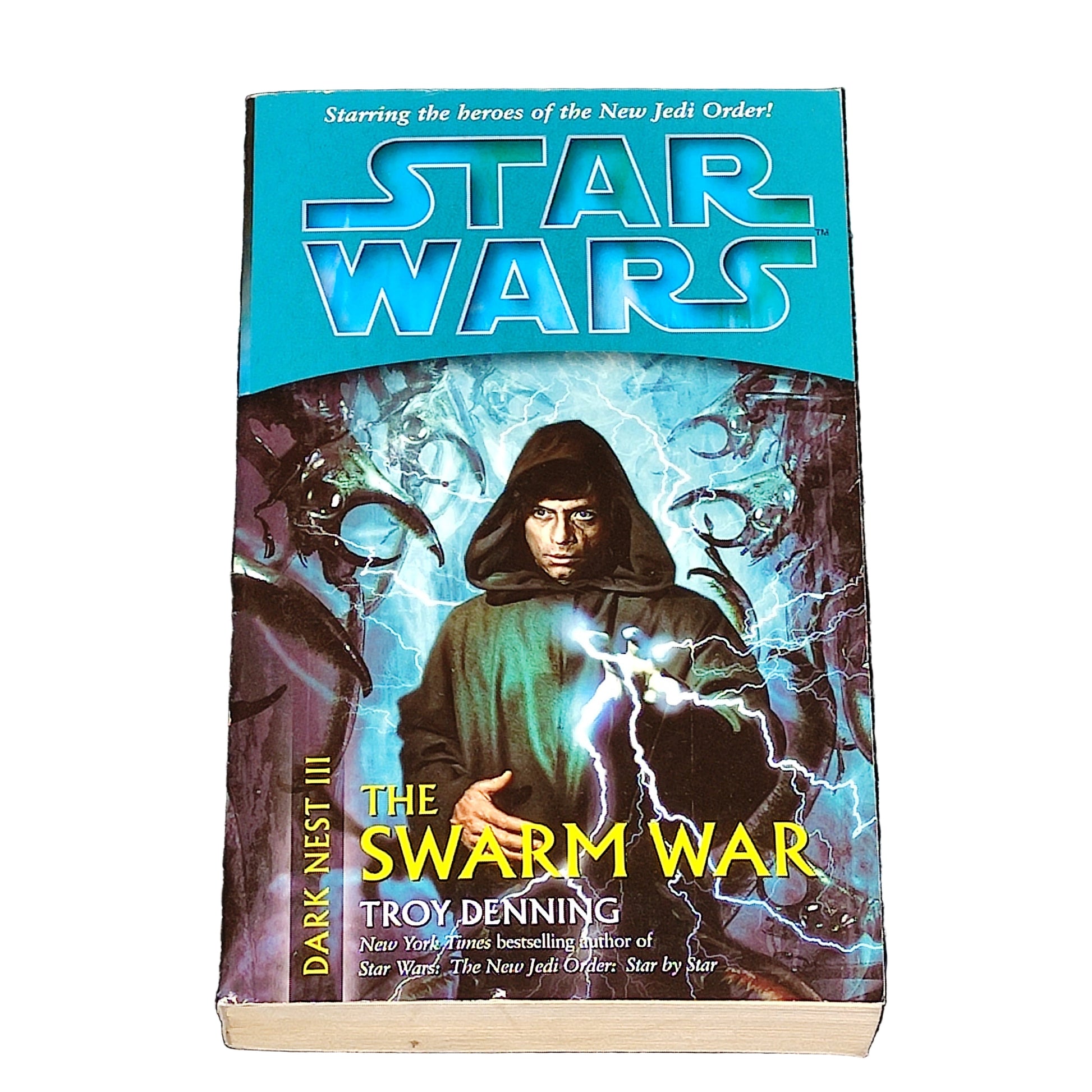 Book titled 'The Swarm War' by Troy Denning with Star Wars branding on a textured surface.