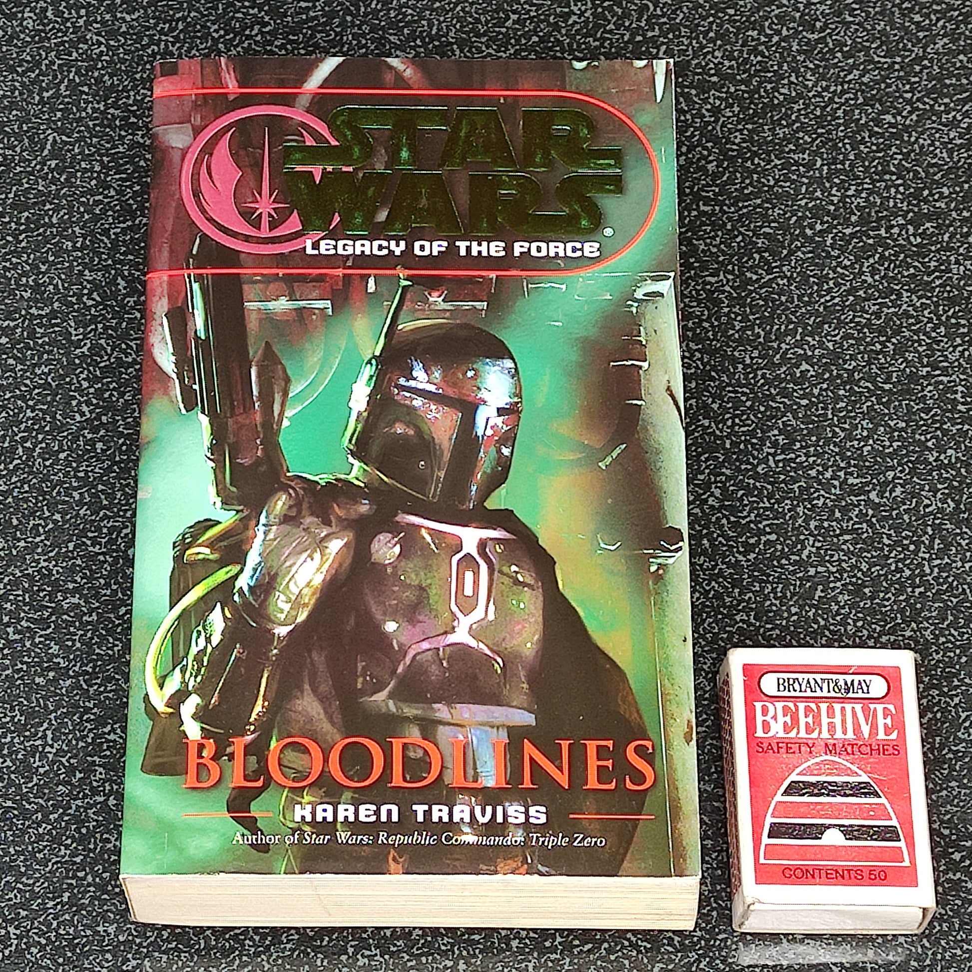 Star Wars book titled 'Bloodlines' by Karen Traviss on a textured surface