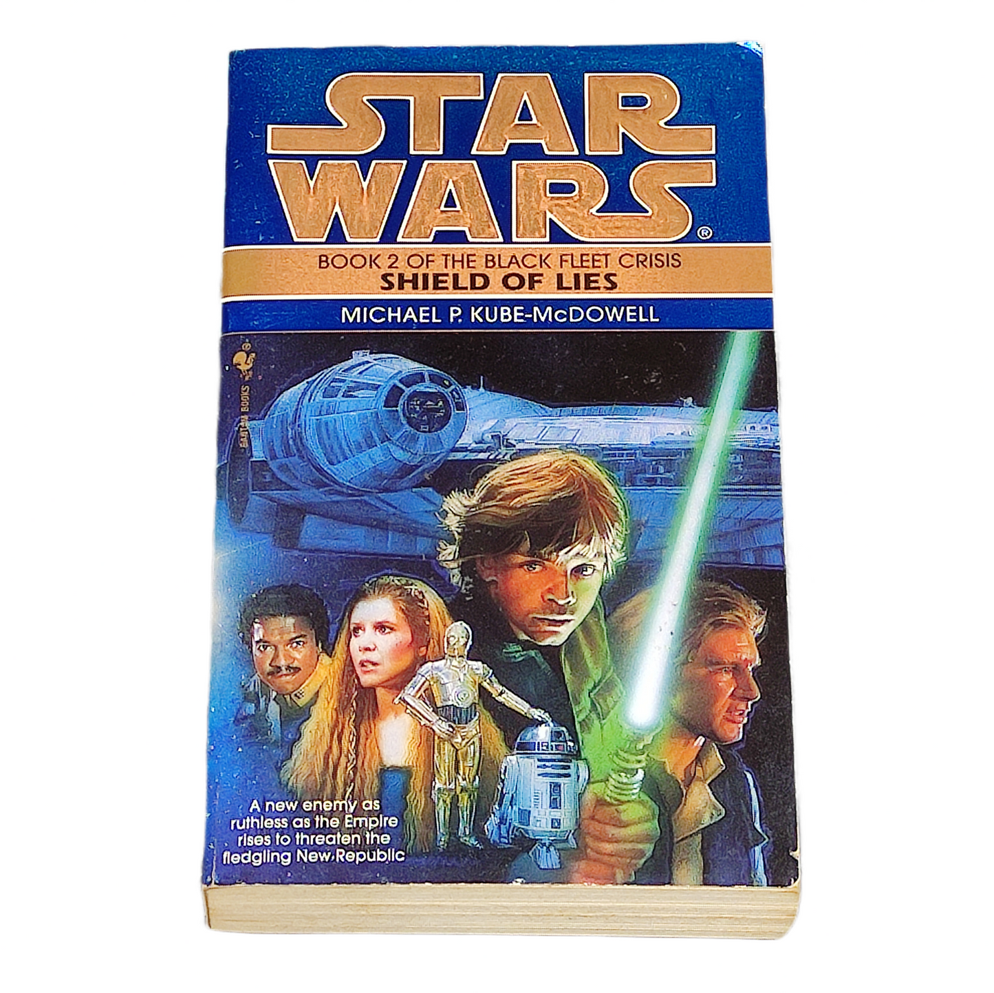 Book cover of 'Star Wars' with characters and spaceship on a blue and gold background