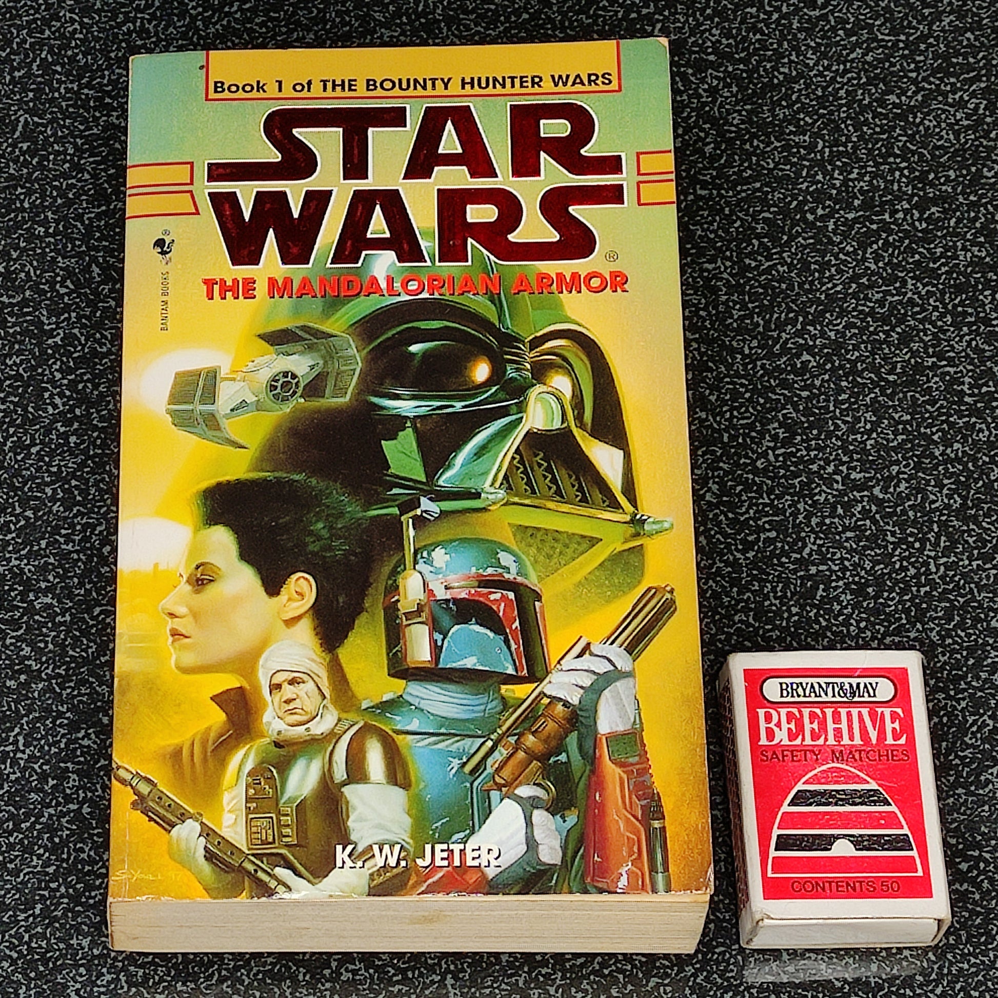 Book titled 'The Mandalorian Armor' from 'Star Wars' series on a dark textured background