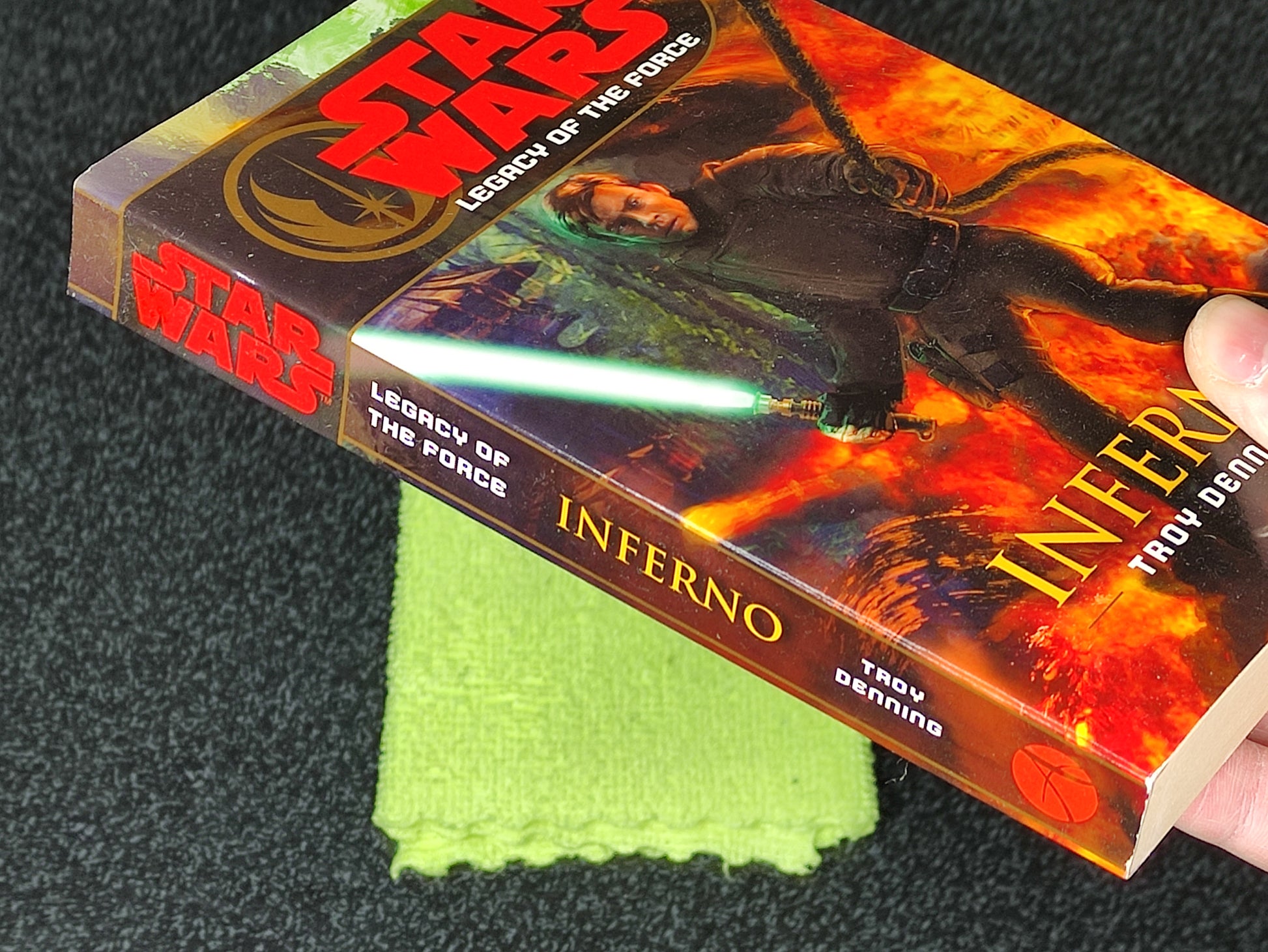 Book titled 'Inferno' from the 'Star Wars' series held against a dark background