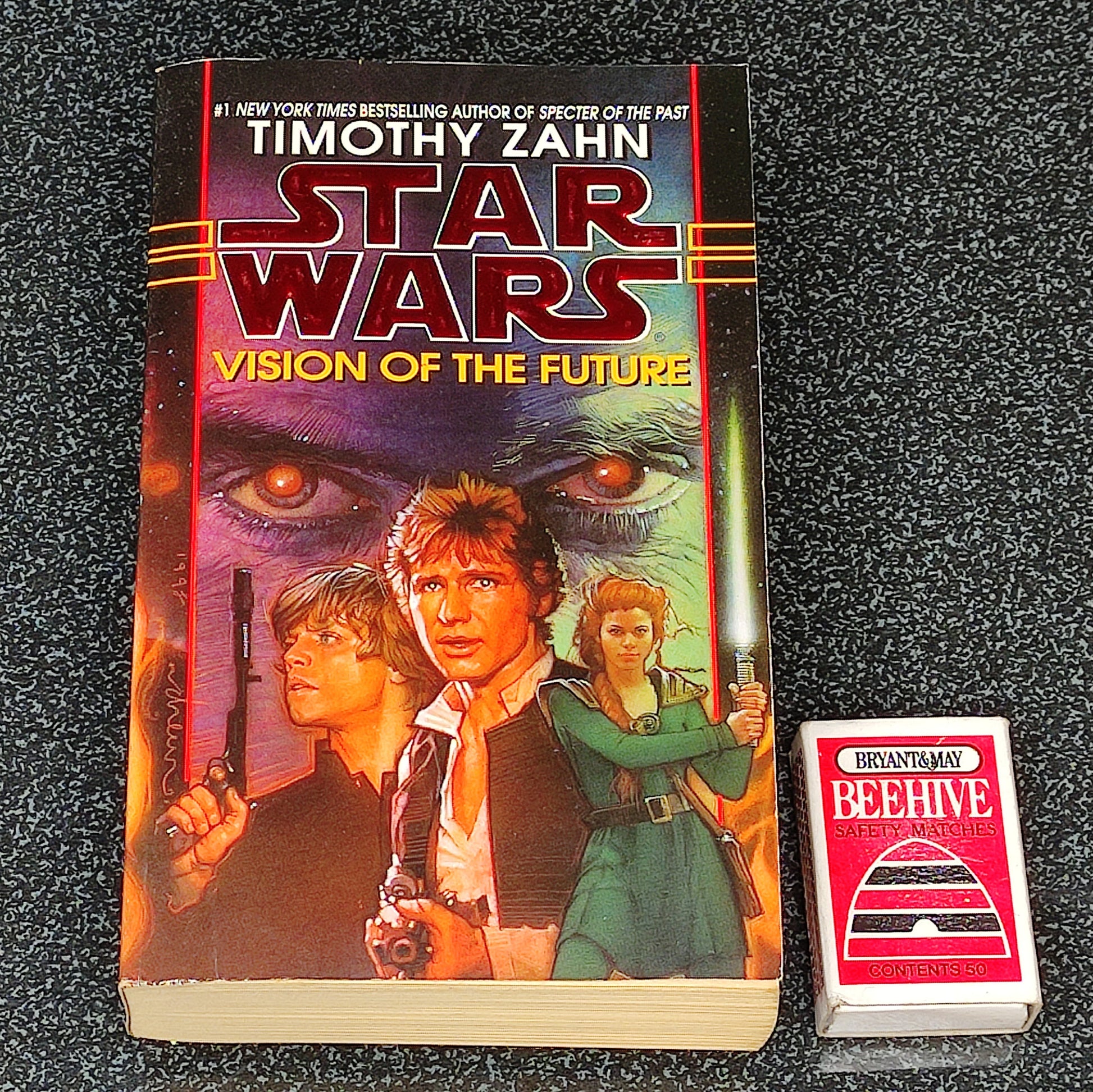 Book titled 'Star Wars: Vision of the Future' by Timothy Zahn on a dark textured surface