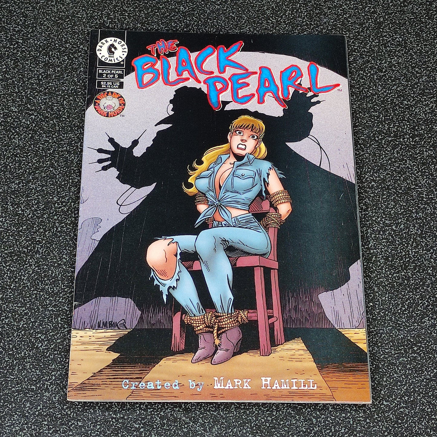 Comic book cover titled 'The Black Pearl' featuring a character on a stool with a dark silhouette in the background.
