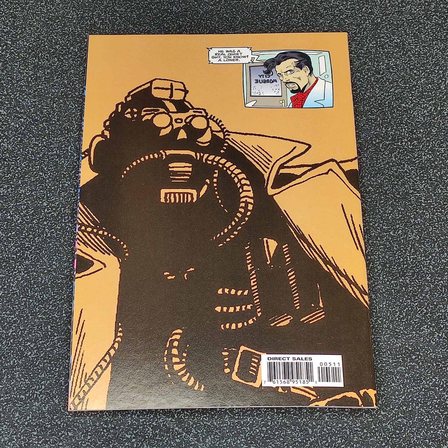 Comic book cover with a robot and a character's face inset on an orange background