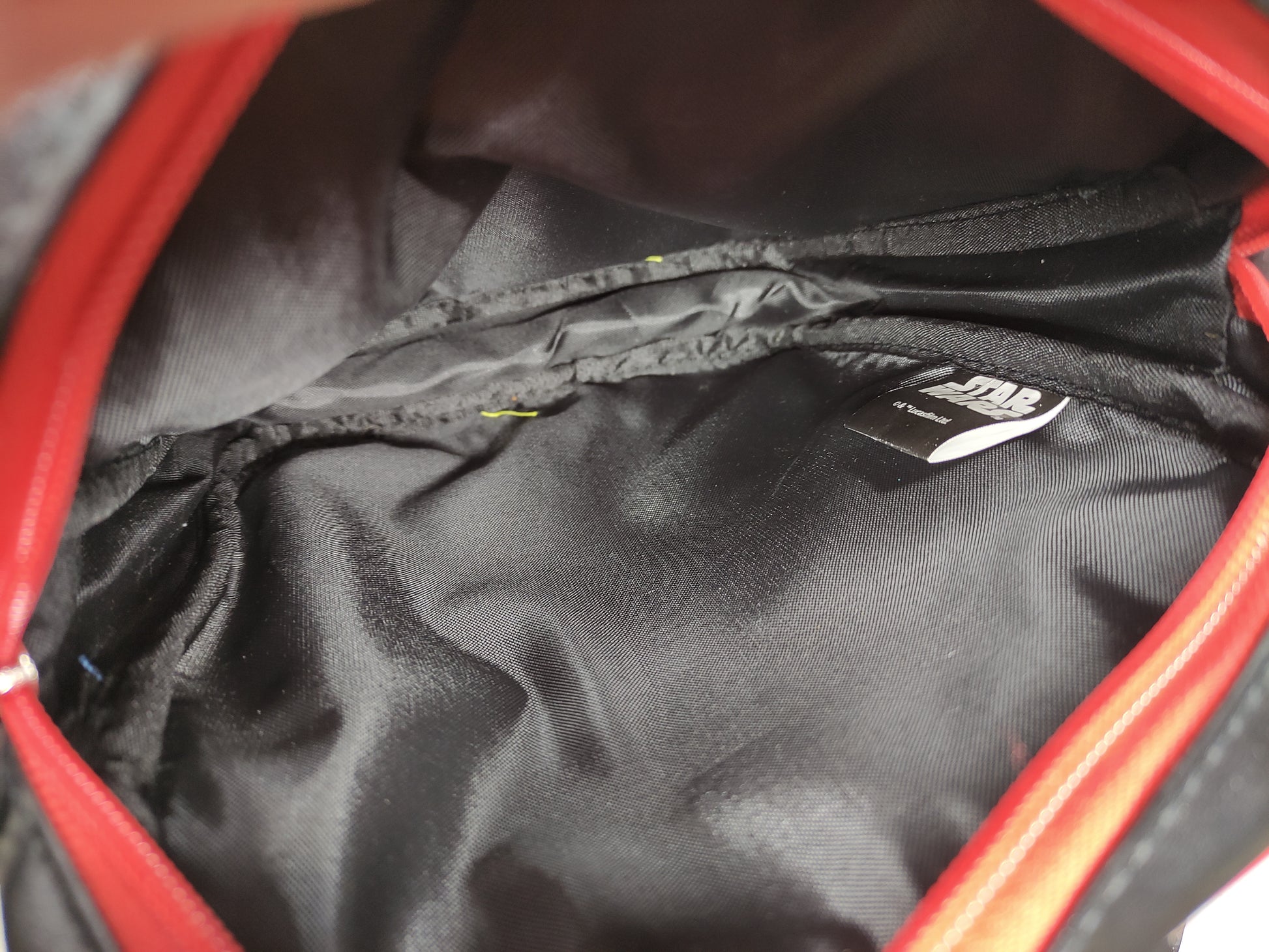 Inside Star Wars-themed bag with characters and 'The Force Awakens' text on a black background
