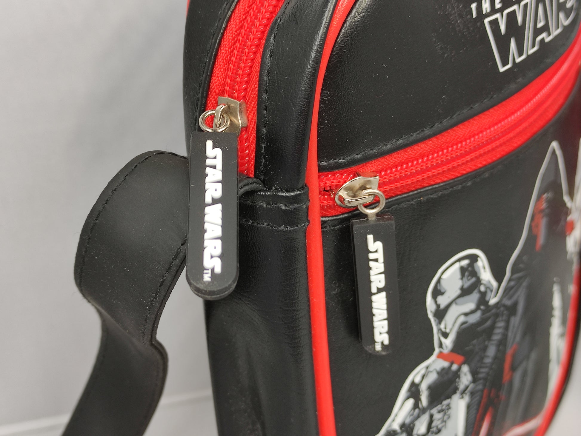 Star Wars-themed bag with characters and 'The Force Awakens' text on a black background