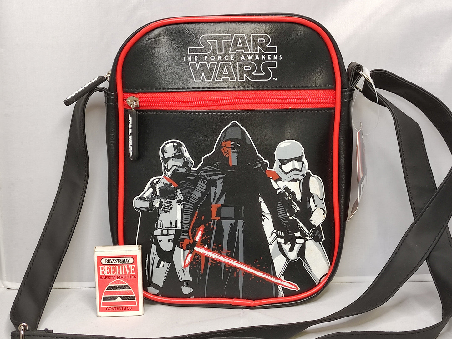 Star Wars-themed shoulder bag with characters and 'The Force Awakens' text on a white background