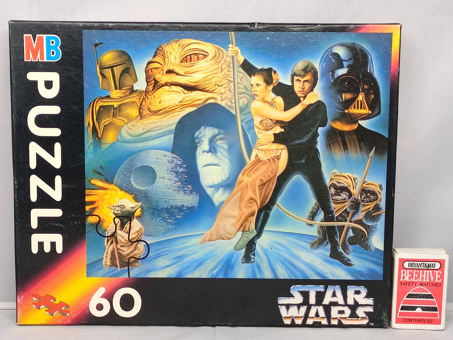 Star Wars puzzle box with characters and 'MB Puzzle' branding on a light gray background