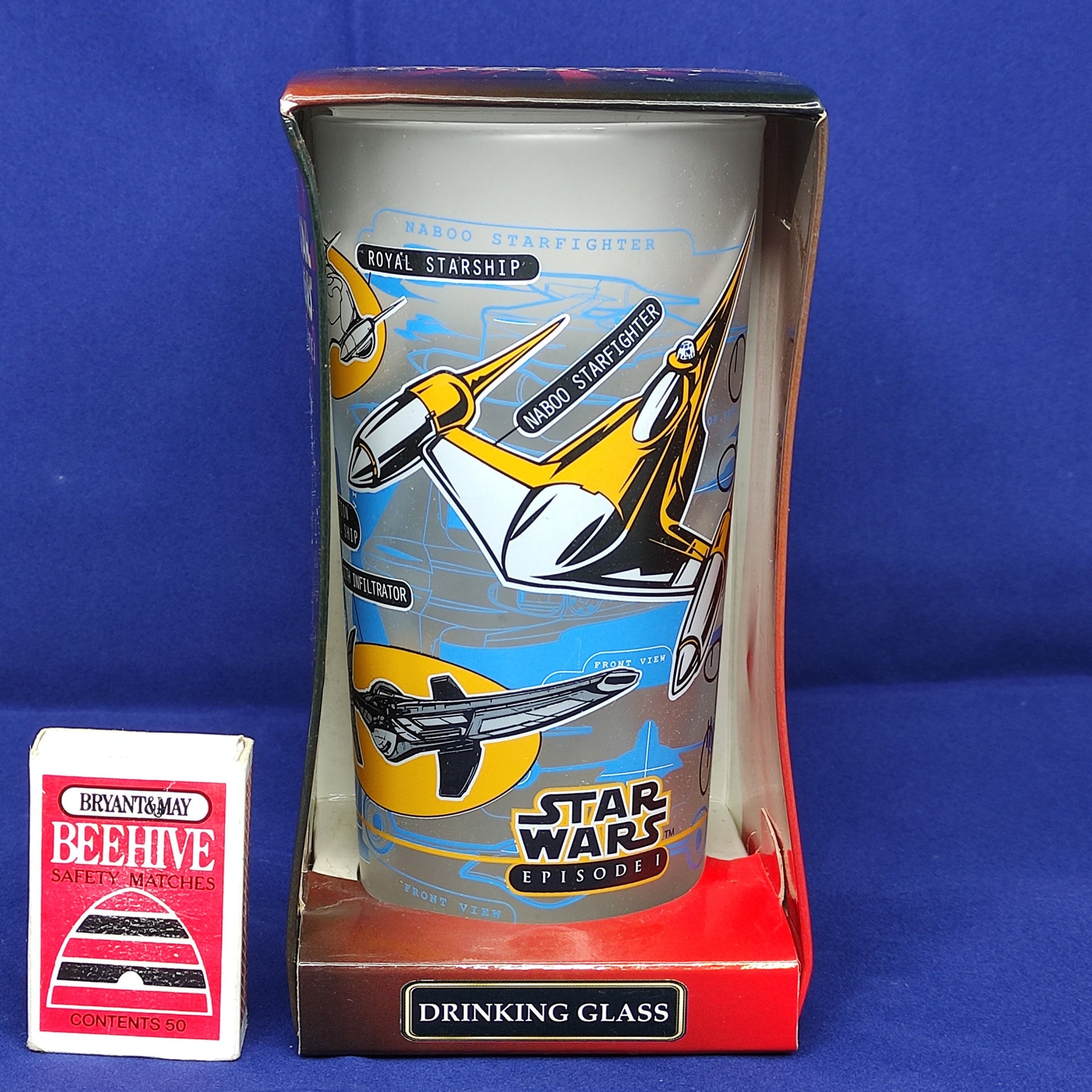 Star Wars-themed drinking glass in packaging on a blue background