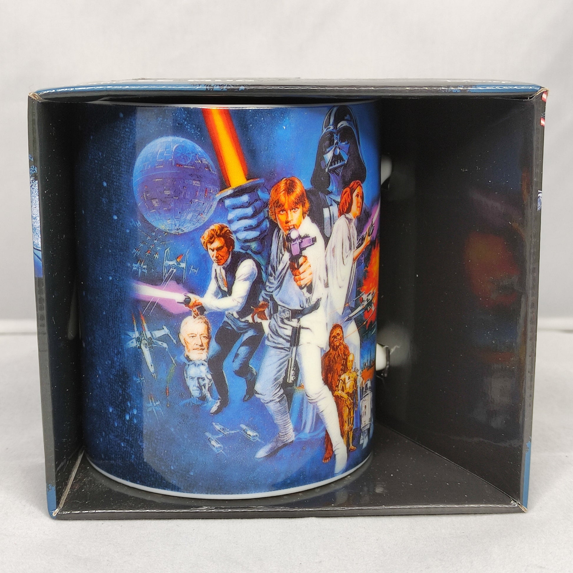 Star Wars-themed mug in a decorative box on a white background