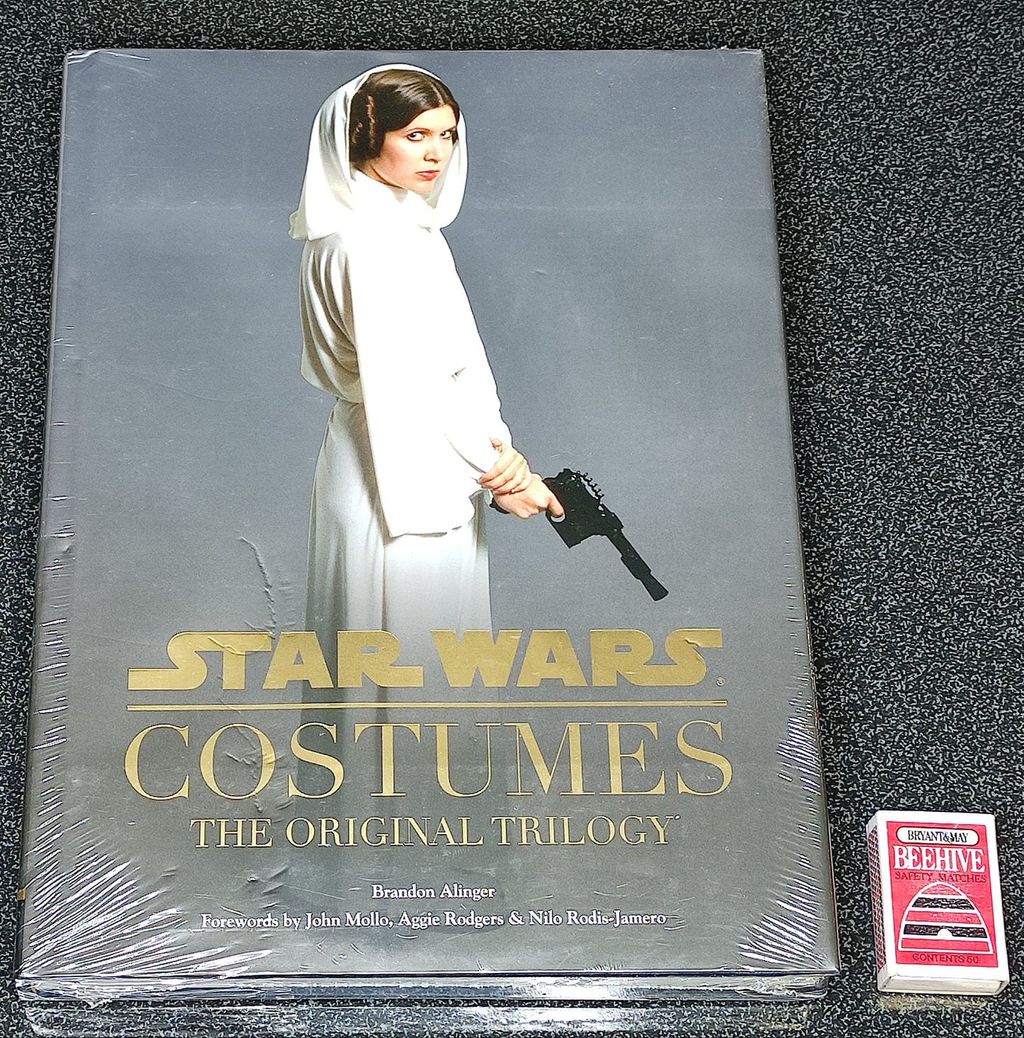 Star Wars Costumes: The Original Trilogy book on a textured surface