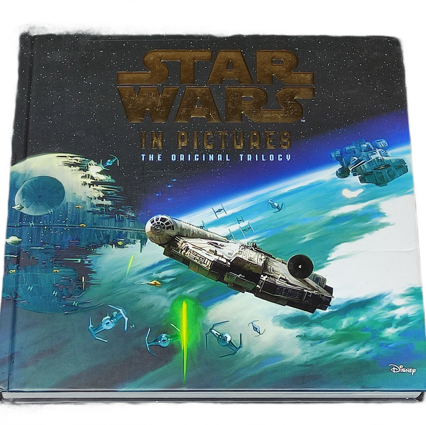 Star Wars book titled 'In Pictures: The Original Trilogy' with spaceship illustration on cover