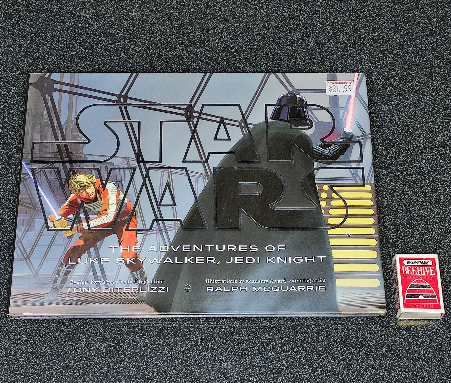 Star Wars book with a figurine on a dark textured surface