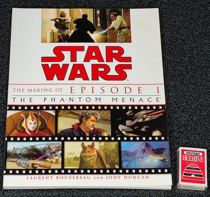 Book titled 'Star Wars: The Making of Episode I The Phantom Menace' on a dark textured surface.