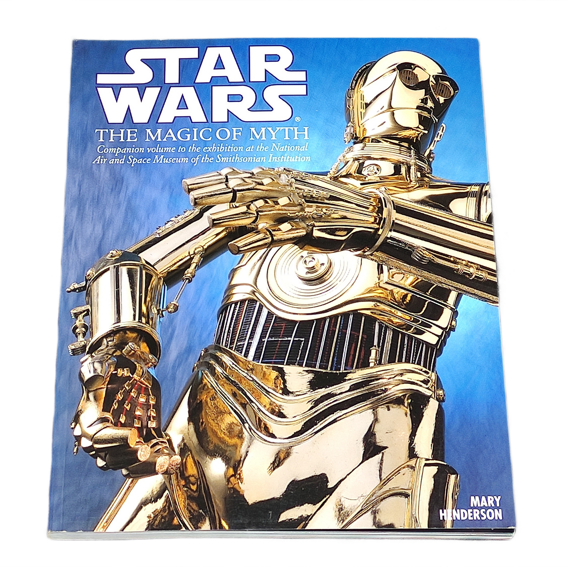 Book titled 'Star Wars: The Magic of Myth' with a gold robot on the cover against a blue background.