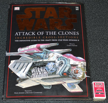 Star Wars book titled 'Attack of the Clones' on a textured surface
