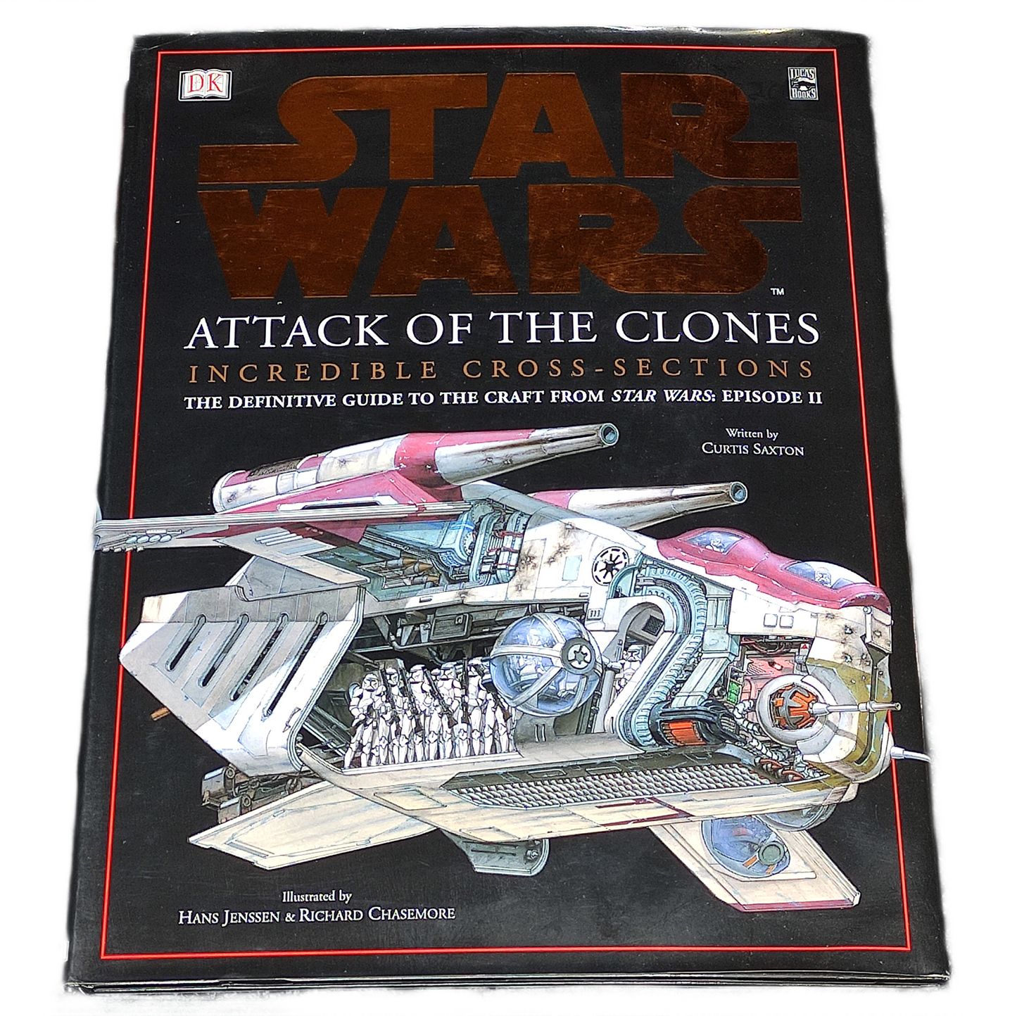 Book titled 'Star Wars: Attack of the Clones' with a cutaway illustration on the cover.