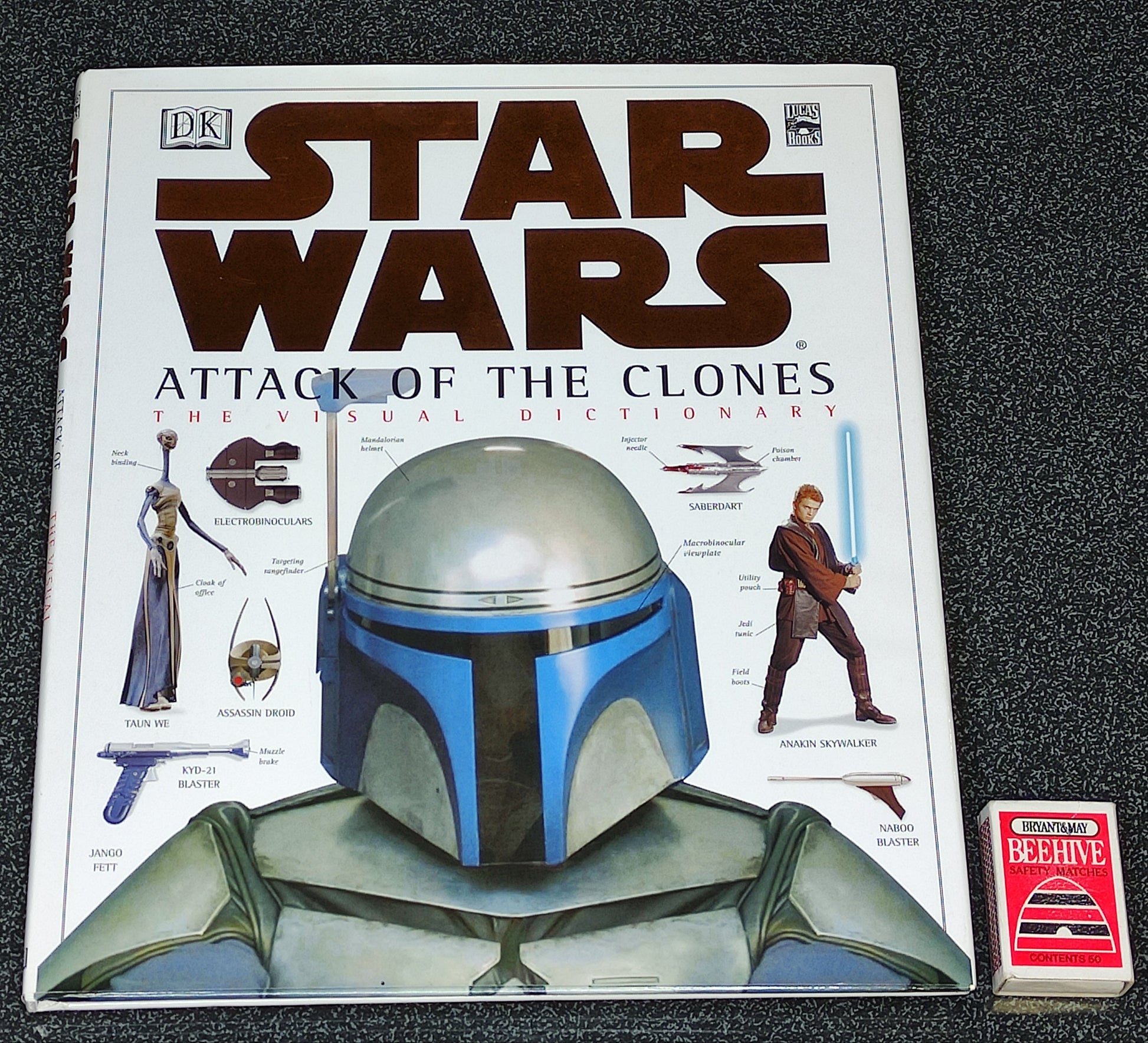 Star Wars book titled 'Attack of the Clones' with a character wearing a helmet on the cover.
