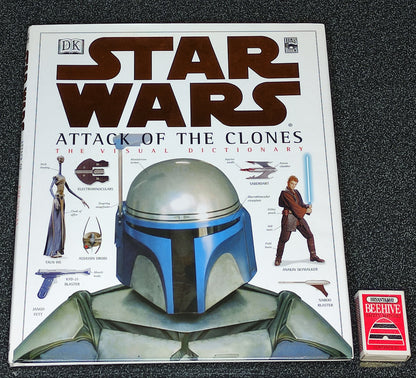 Star Wars book titled 'Attack of the Clones' with a character wearing a helmet on the cover.