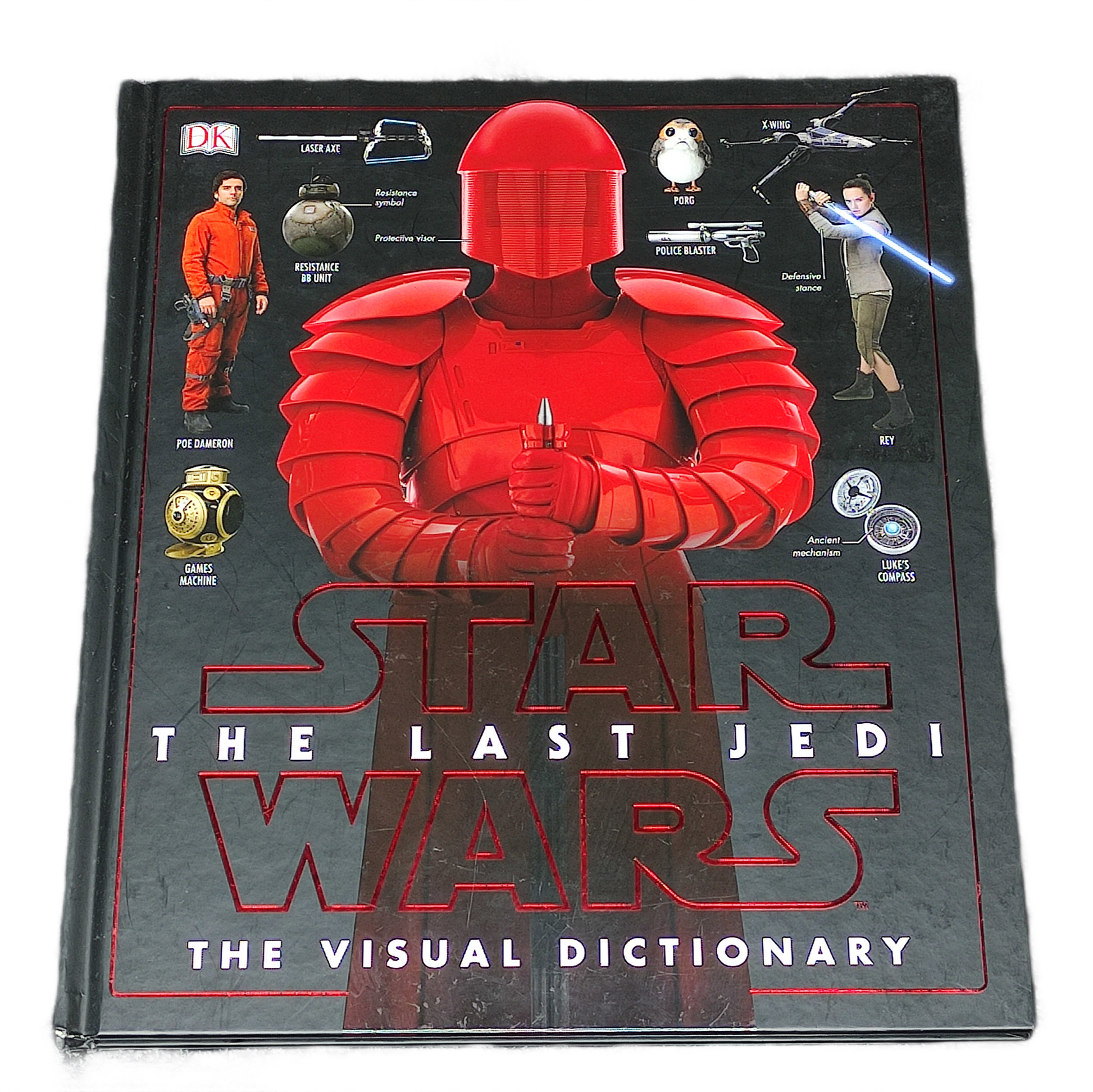 Book titled 'Star Wars: The Last Jedi The Visual Dictionary' with a red character on the cover.