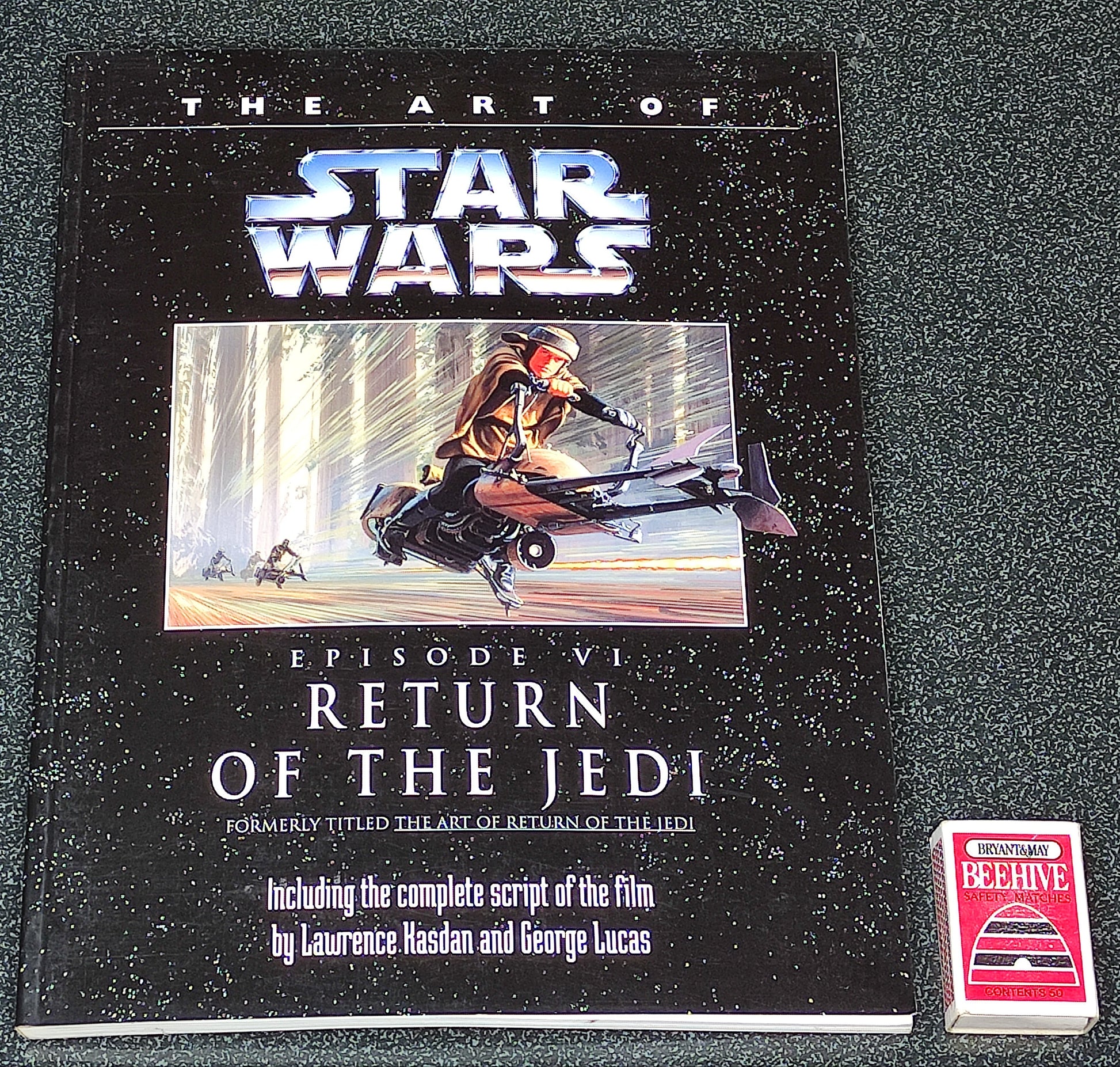 Book titled 'The Art of Star Wars Episode VI: Return of the Jedi' on a dark surface