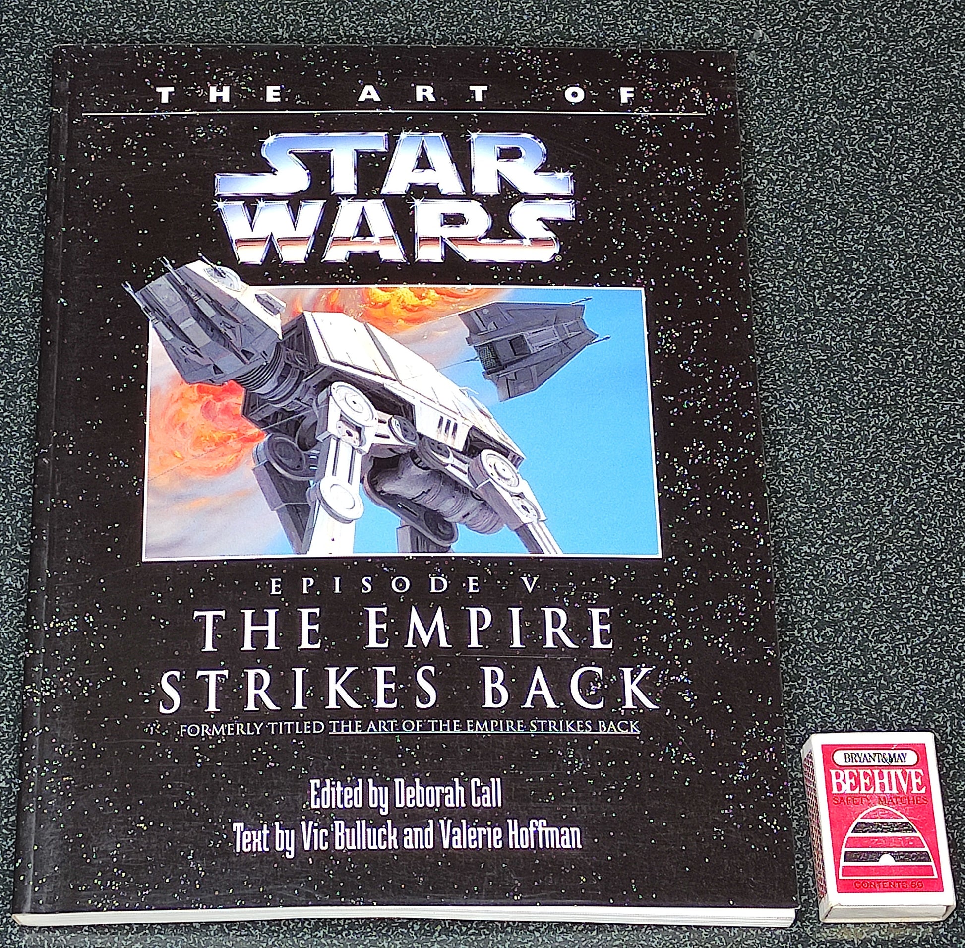 Book titled 'The Art of Star Wars: Episode V The Empire Strikes Back' on a gray background