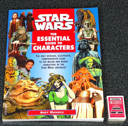 Book titled 'Star Wars: The Essential Guide to Characters' on a dark background