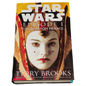 Book cover of 'Star Wars Episode I: The Phantom Menace' by Terry Brooks with a character's face on the cover.