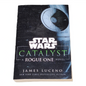 Book titled 'Catalyst: A Rogue One Novel' by James Luceno with a Star Wars logo on a white background.