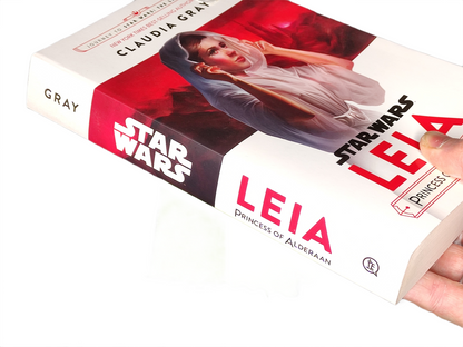 Book titled 'Star Wars: Leia' by Claudia Gray with a hand holding it.