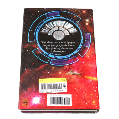 Book titled 'Millennium Falcon' by James Luceno with a spaceship illustration on a colourful background.