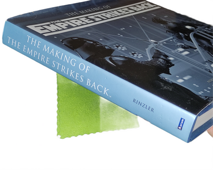 Book titled 'The Making of The Empire Strikes Back' with a star wars character on the cover.