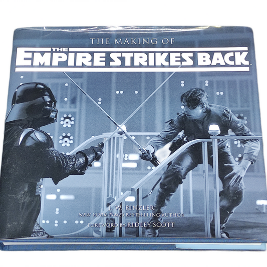 Book titled 'The Making of The Empire Strikes Back' with images of Darth Vader and a character on a white background.