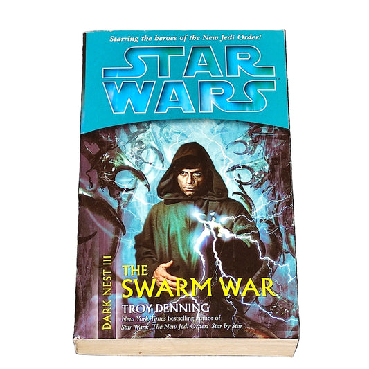 Book titled 'The Swarm War' by Troy Denning with Star Wars branding on a textured surface.