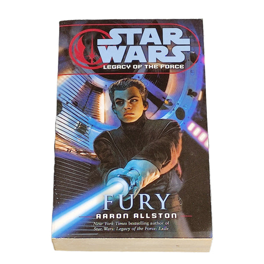 Book titled 'Star Wars: Legacy of the Force Fury' on a white surface