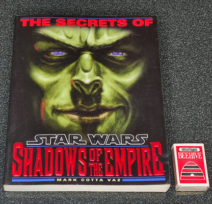 Book titled 'The Secrets of Star Wars: Shadows of the Empire' on a textured surface