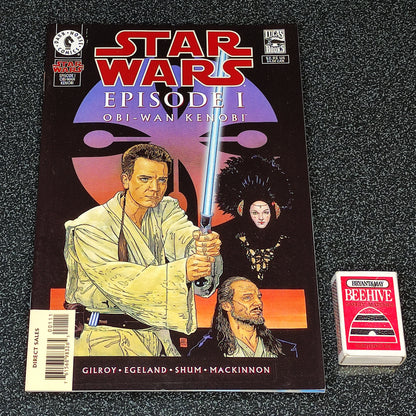 Star Wars Episode I comic book with a trading card on a textured surface