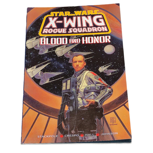 Book titled 'X-Wing Rogue Squadron: Blood and Honor' on a textured surface