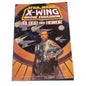 Book titled 'X-Wing Rogue Squadron: Blood and Honor' on a textured surface